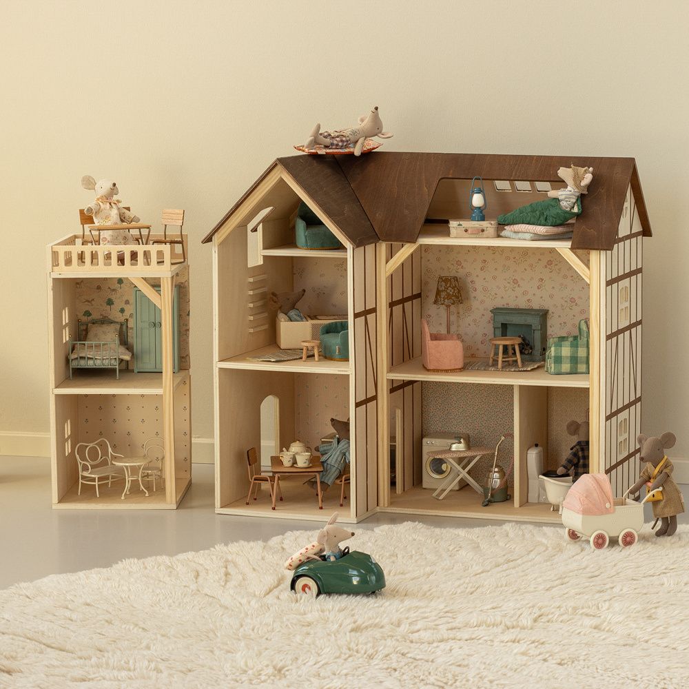 Maileg dollhouses filled with miniature furniture and toy mice, featuring detailed room settings, tiny accessories, and playful scenes